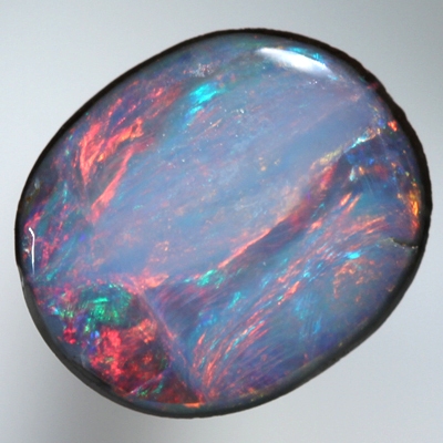 SOLID BOULDER OPAL Bright red rolling flashes in a unique pattern